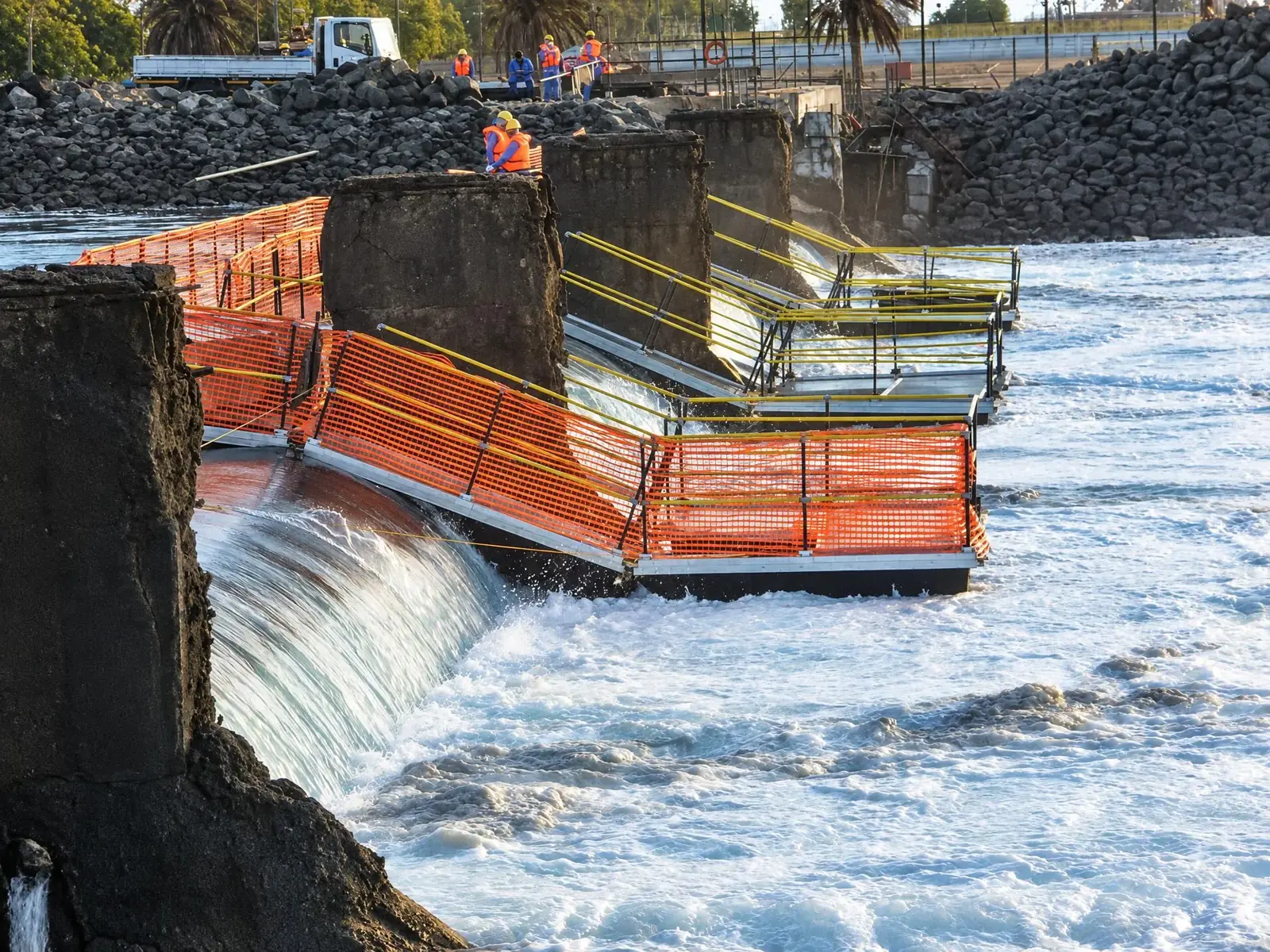 Walkway over fast-moving water at the Marafiq plant weir in Saudi Arabia