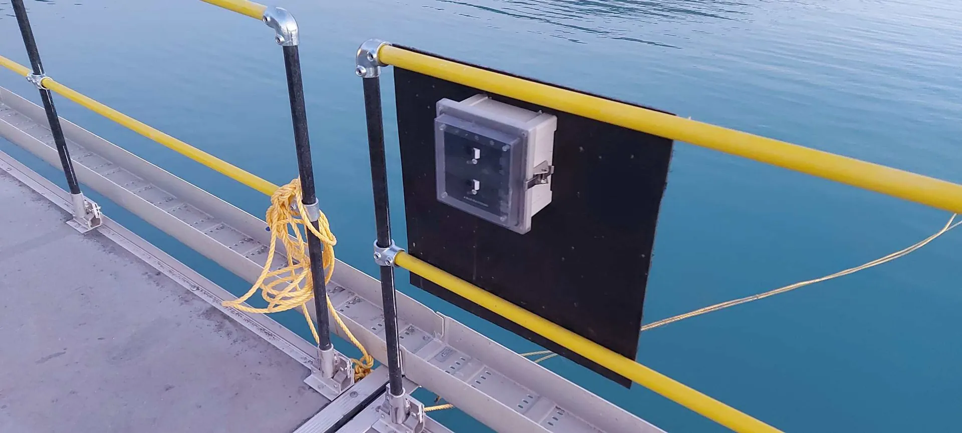 Worker walking the Xrosswater walkway toward the pump